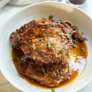 Egg foo young patties with sauce.