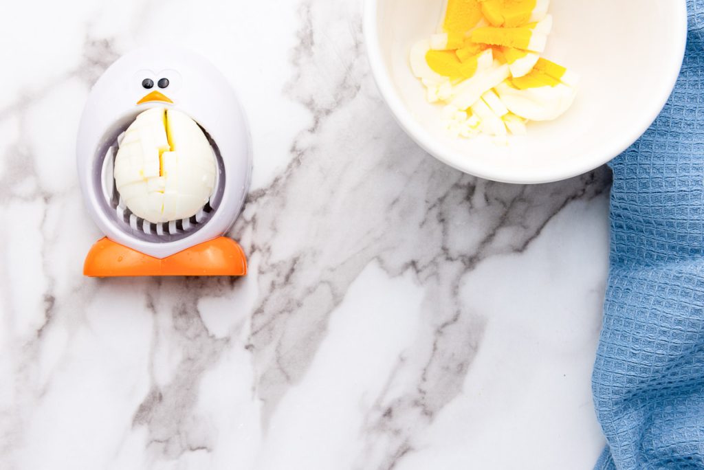 A penguin egg grater on a countertop.