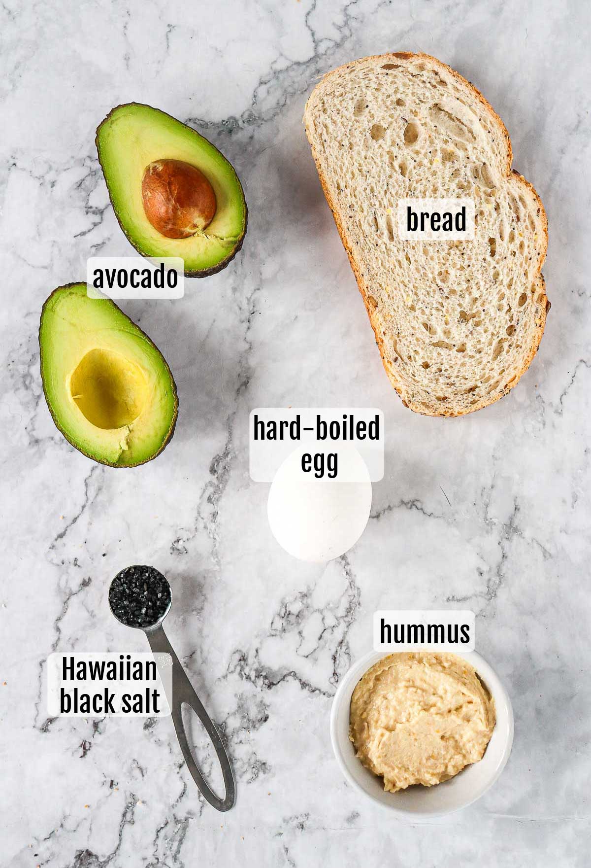 Ingredients for a Hawaiian avocado toast with shaved egg.