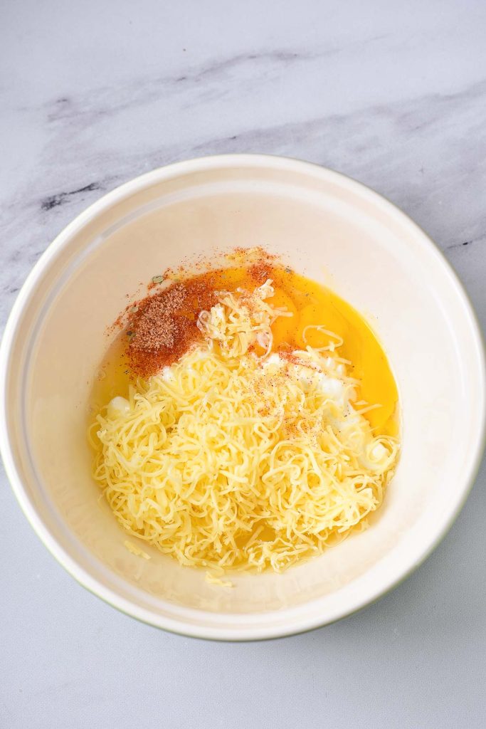 A bowl with noodles and spices in it, perfect for a quick meal.