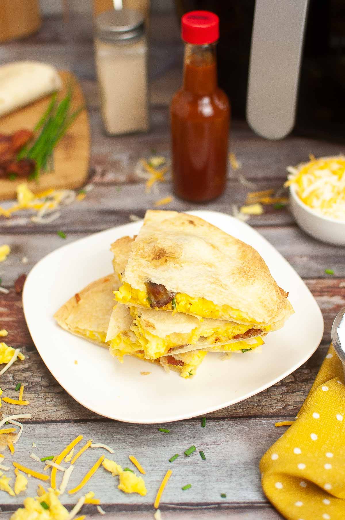 A breakfast quesadilla with eggs and bacon